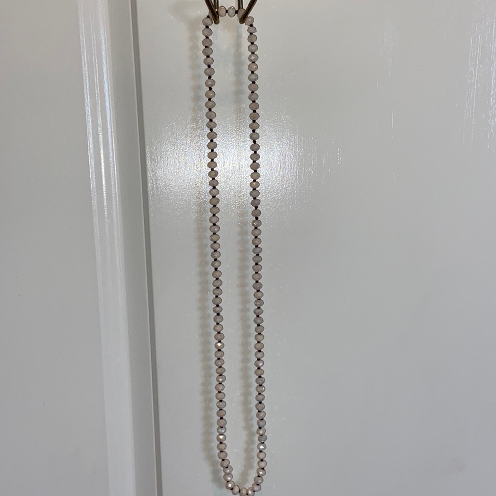 Cream colored beaded long necklace. Never worn.